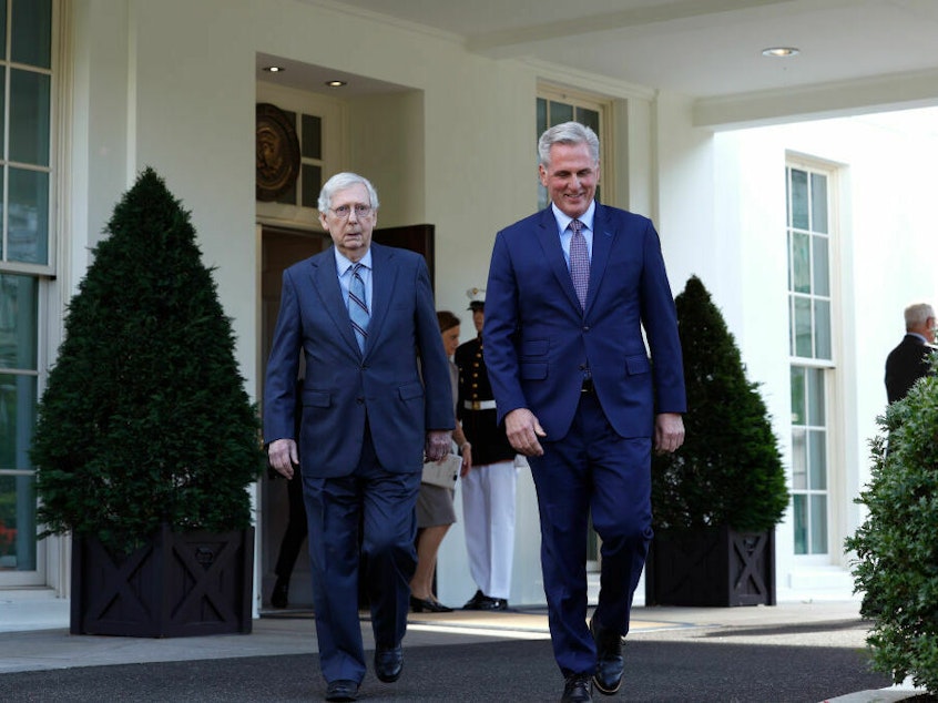 caption: Senate Minority Leader Mitch McConnell, R-K.Y., and Speaker of the House Kevin McCarthy, R-Calif., leave after meeting with President Biden at the White House on Tuesday. They are canceling a planned meeting for Friday as staffers make progress on debt ceiling talks.