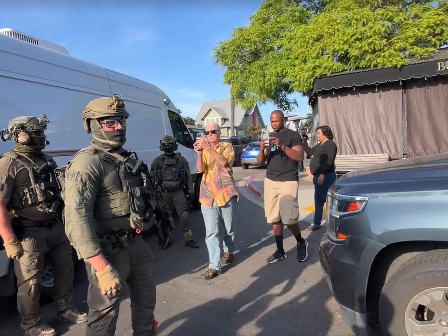 caption: U.S. Immigration and Customs Enforcement agents execute a criminal search warrant on Friday, at the Buona Forchetta Italian restaurant in San Diego.