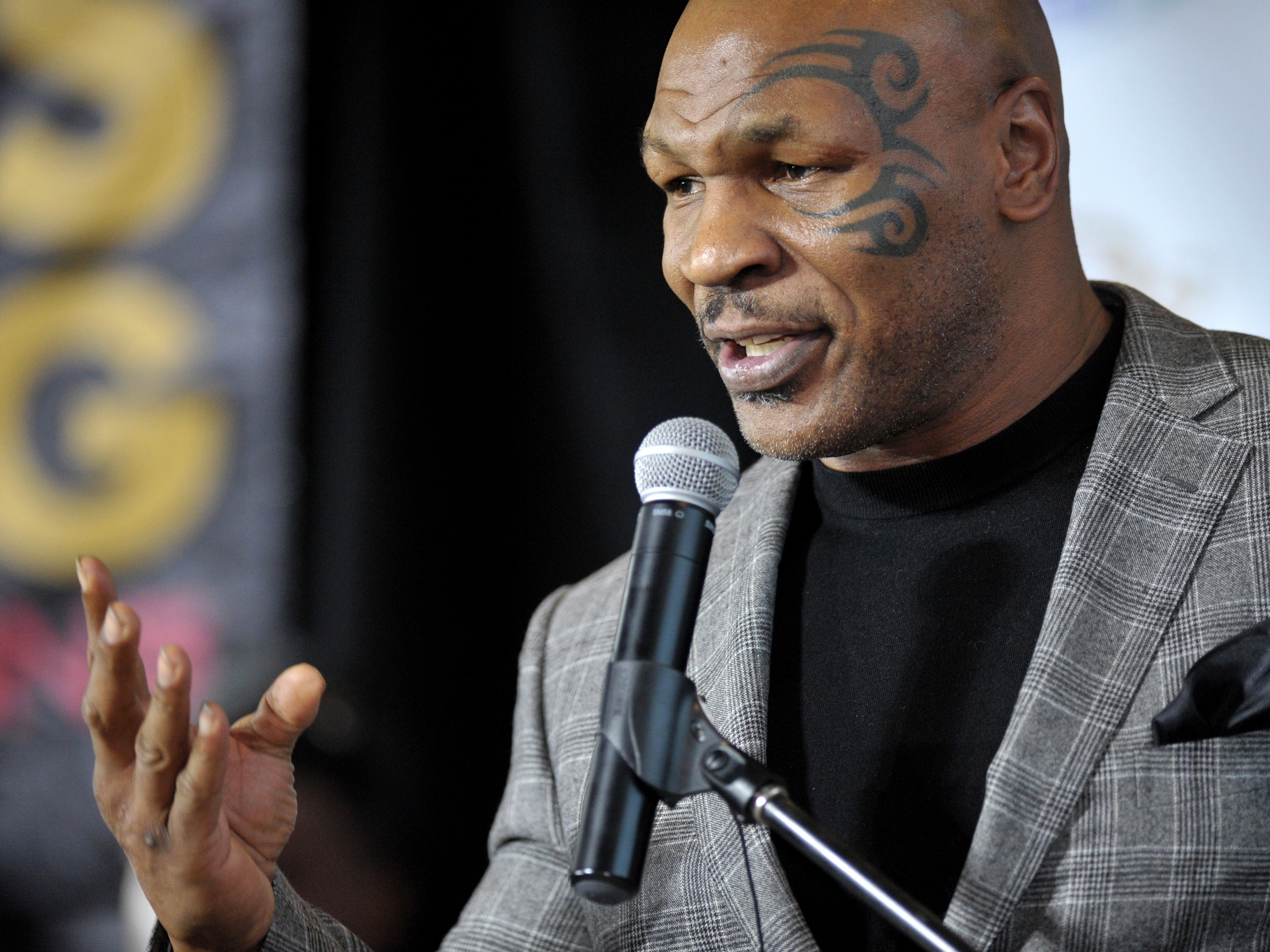 caption: Former boxer Mike Tyson holds a news conference on Feb. 21, 2014, in Bethlehem, Pa. Authorities will not file criminal charges against Tyson after he was recorded on video punching a fellow first-class passenger last month, prosecutors announced Tuesday.