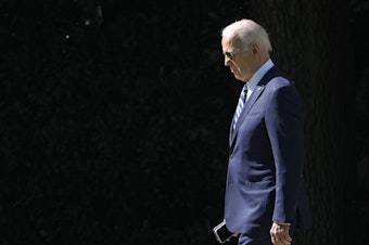 caption: President Biden walks toward Marine One on the South Lawn of the White House on Fri., Oct. 13, 2023.