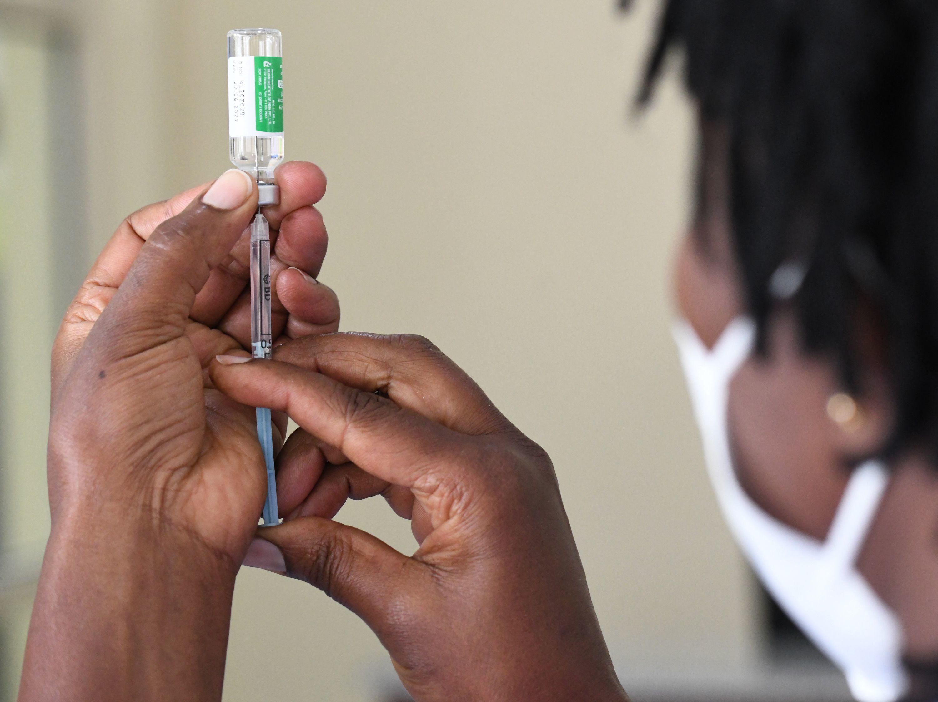 caption: Despite global pledges on vaccine supply, only 7% of Africa's population is vaccinated.