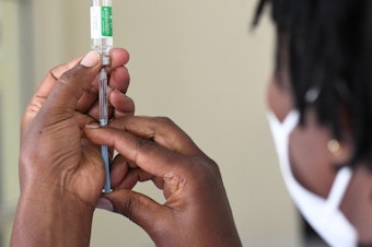 caption: Despite global pledges on vaccine supply, only 7% of Africa's population is vaccinated.