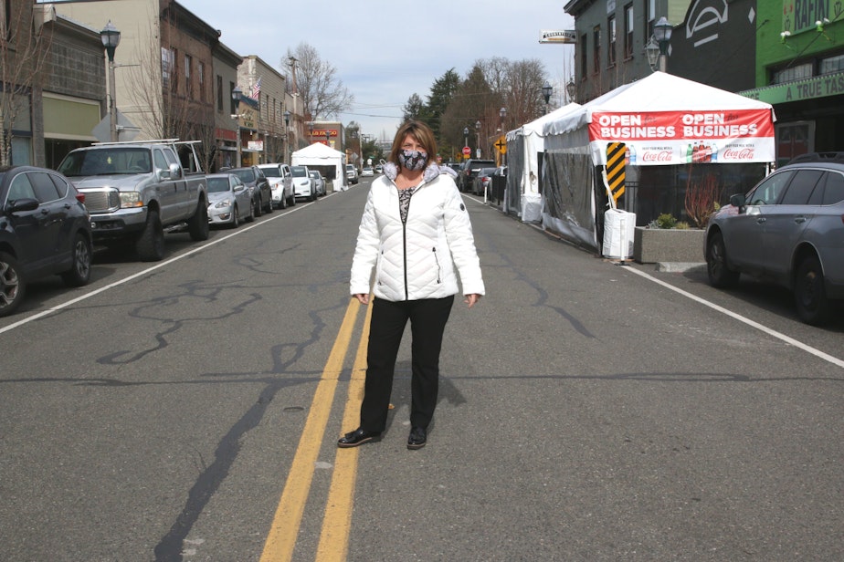 caption: Gaila Haas (Gutierrez) runs the Kent Downtown Partnership, which worked with the City of Kent to get outdoor dining structures built for restaurants in its downtown core. While protected from elements on 3 sides, they are open on the sidewalk side, in order to maintain good airflow during the pandemic.