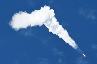 caption: A SpaceX Falcon 9 rocket heads for orbit after lifting off from the Cape Canaveral Space Force Station on May 26. The same type of rocket is expected to launch a low-Earth billboard next year.