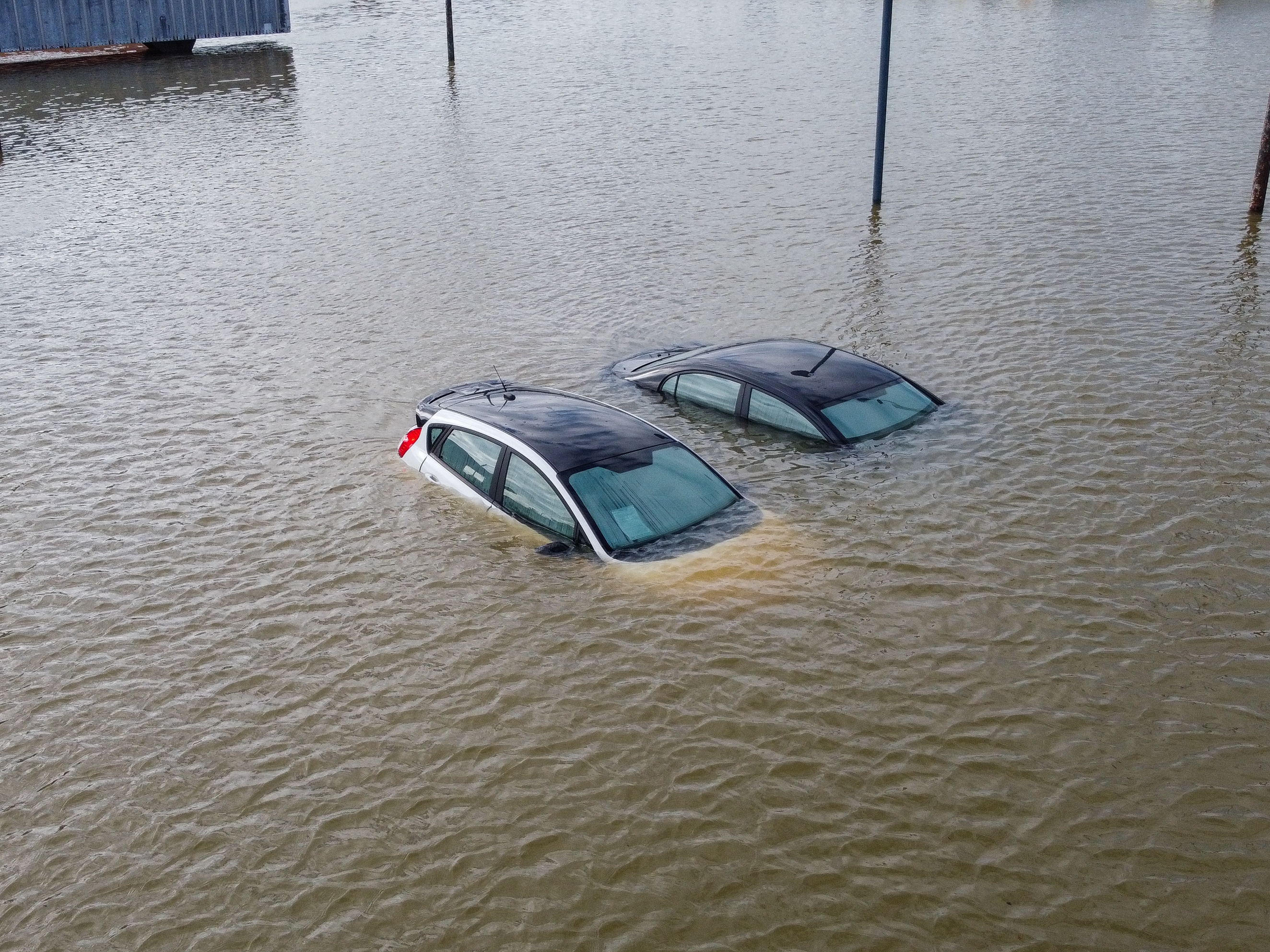 caption: An aerial view of severe flooding in Frankfort, Kentucky, caused by days of heavy rainfall on April 7, 2025. Violent storms battering the central-eastern United States killed at least 17 people. The storms came as the National Weather Service was grappling with nearly 600 job cuts by the Trump administration. Now, the NWS has been given authorization to rehire more than 100 forecasters, radar technicians and others.