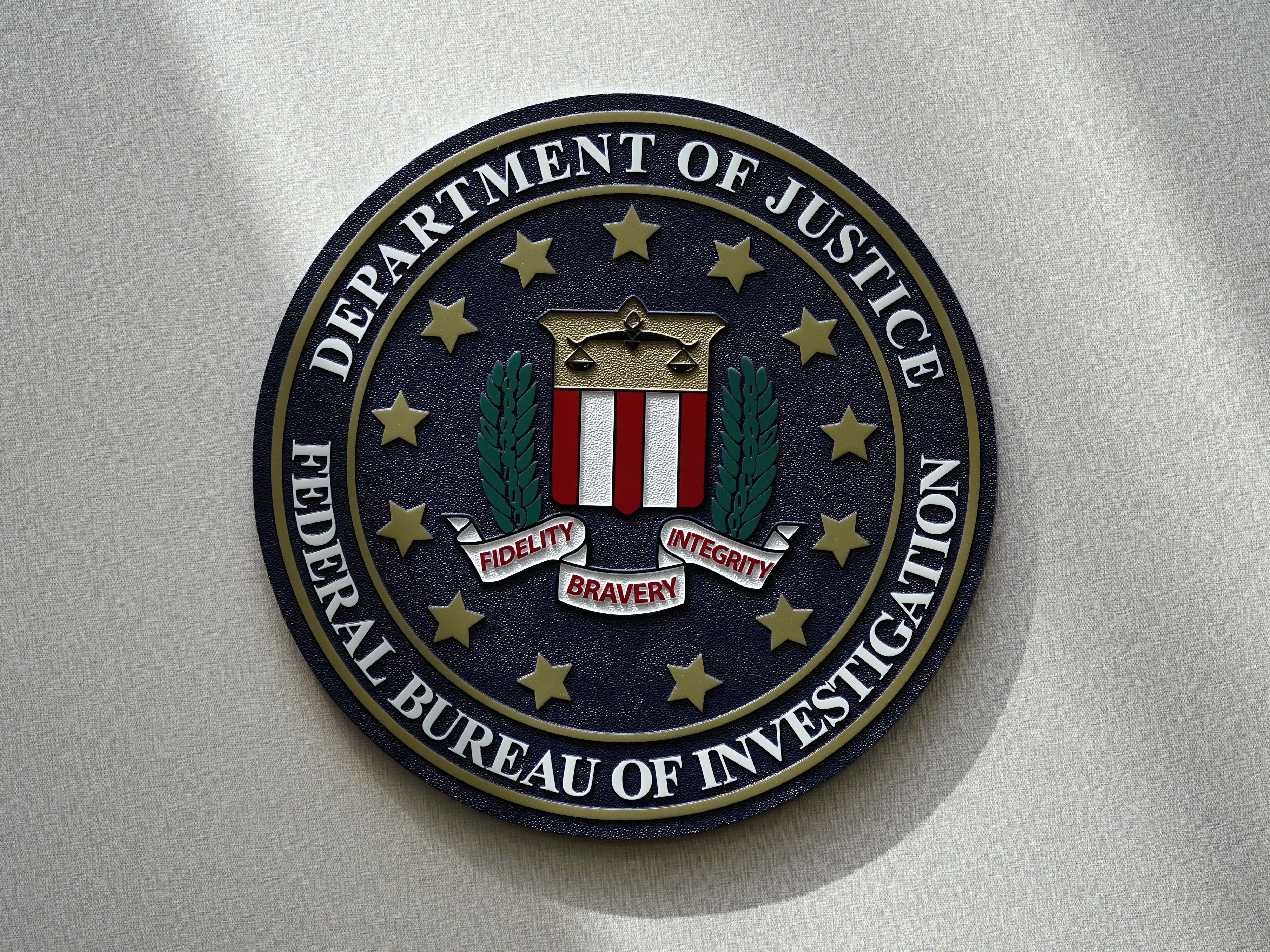 caption: An FBI seal is seen on a wall on Aug. 10, 2022, in Omaha, Neb.