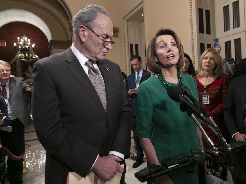 caption: House Speaker-designate Nancy Pelosi, D-Calif., and Senate Minority Leader Chuck Schumer, D-N.Y., address reporters about the fight over funding a border wall before the partial government shutdown. Pelosi will lead House Democrats in voting on a bill to reopen the government when they take power in the House on Thursday.