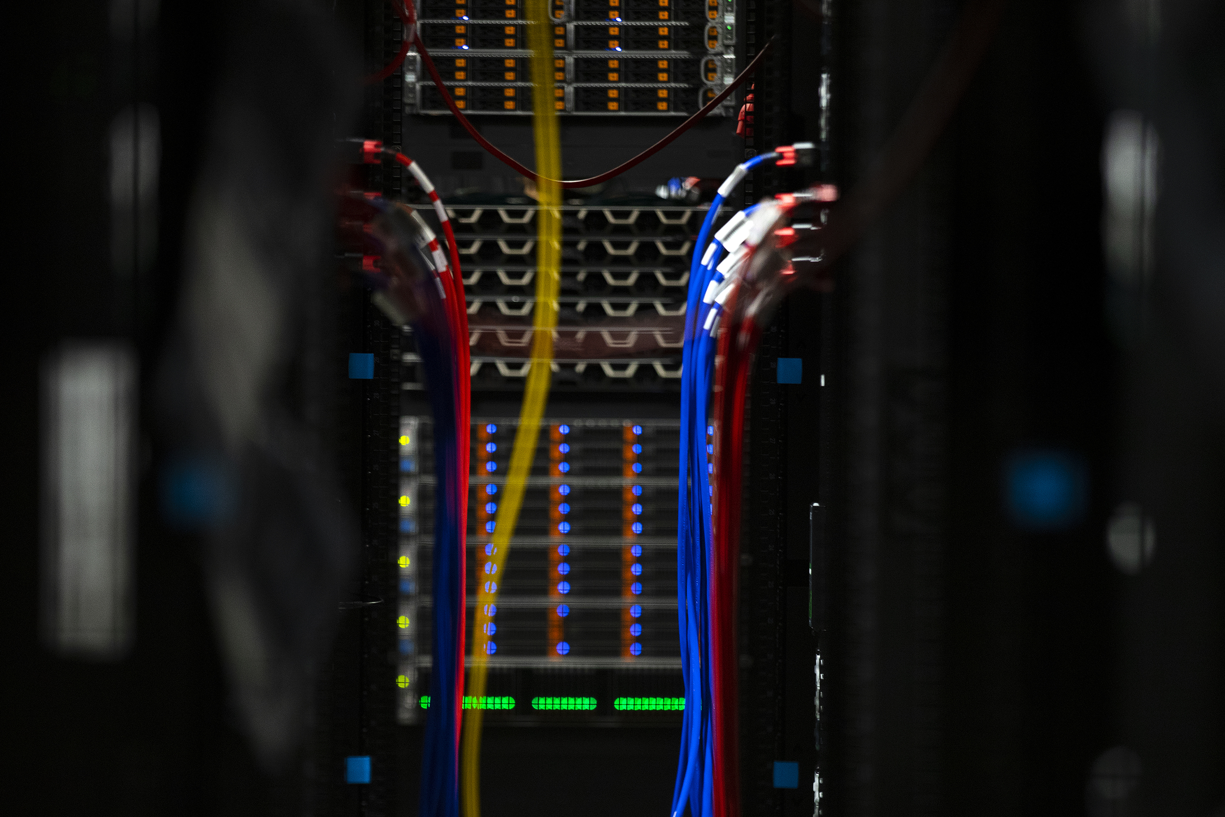 caption: Cables are shown inside a server bank at the Sabey data center on Thursday, July 17, 2025, in Quincy, Washington. 