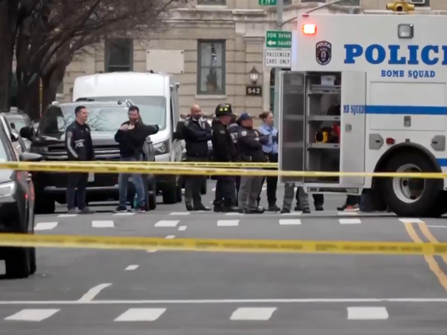 caption: In this image taken from video, law enforcement officers respond to Manhattan's Upper East Side as New York City's police said they had identified a "suspicious device in a vehicle," Sunday, March 8, 2026, in New York. On Saturday, two men from Pennsylvania allegedly threw improvised explosive devices at anti-Muslim protesters.