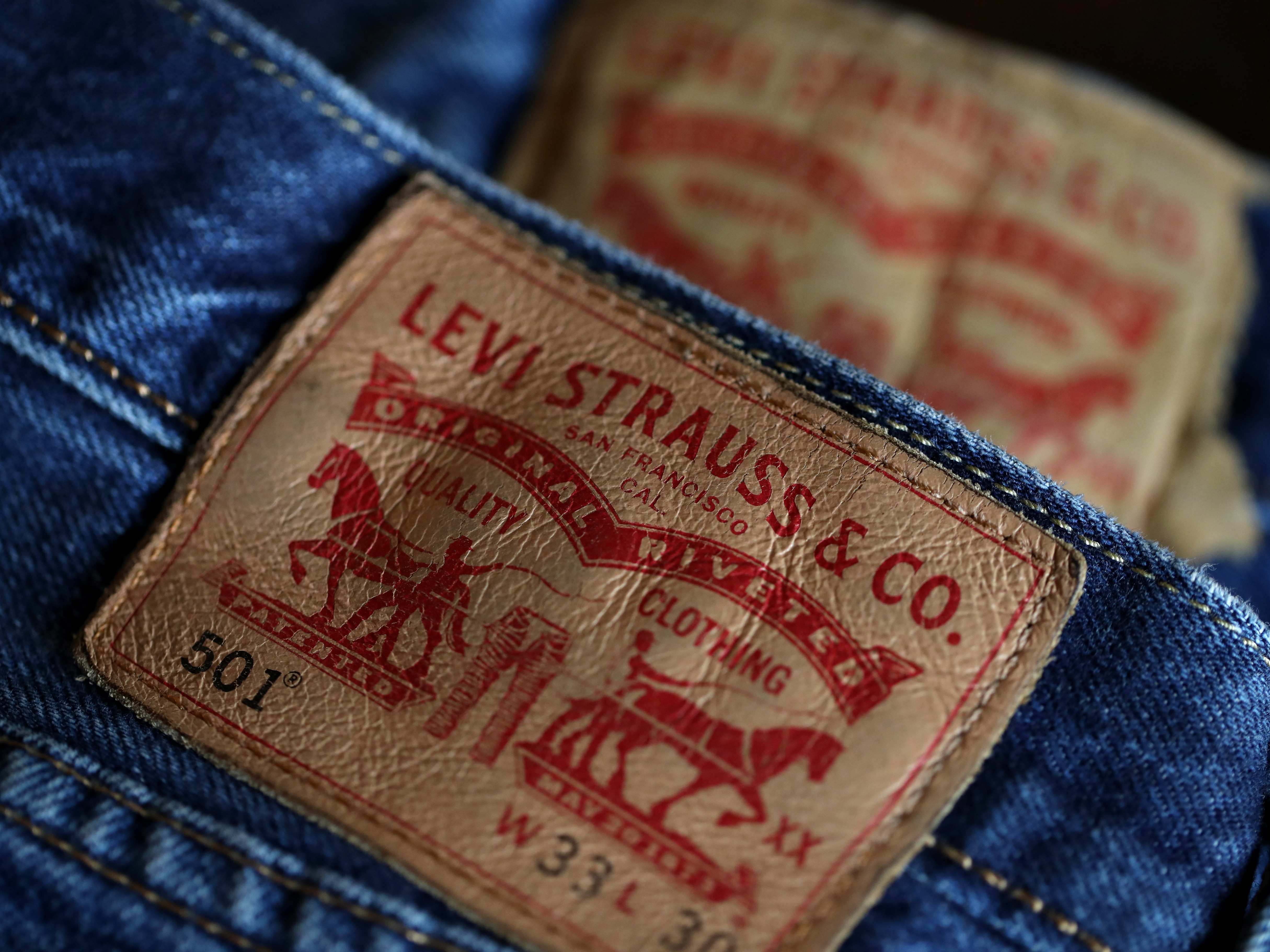 caption: The Levi's logo appears on a pair of the company's 501 jeans in a file photo taken in 2019.