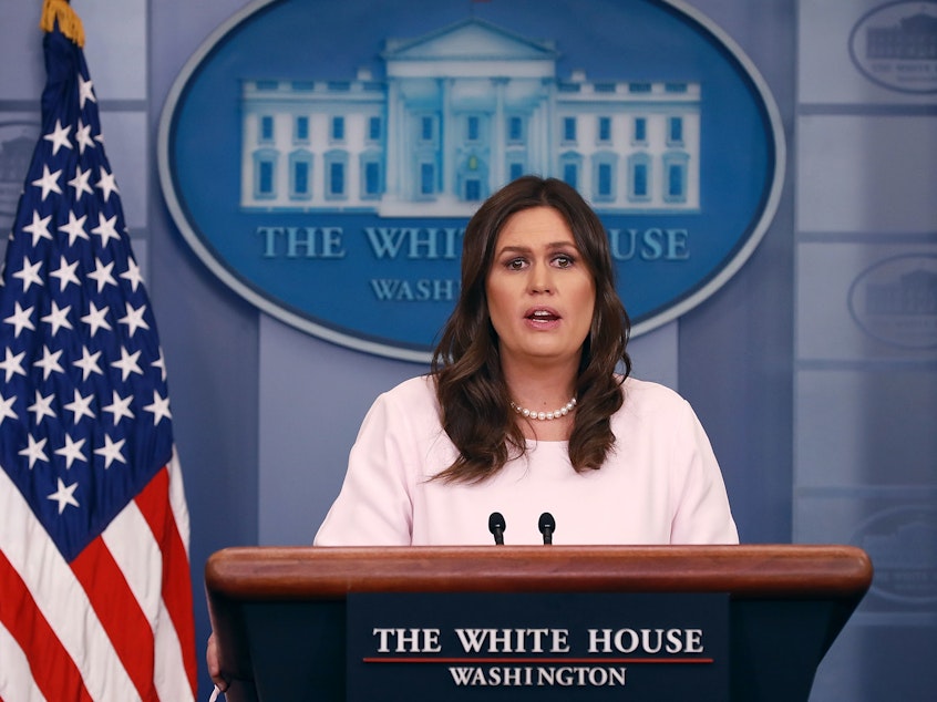 caption: White House press secretary Sarah Sanders conducts a news briefing at the White House in April 2018.