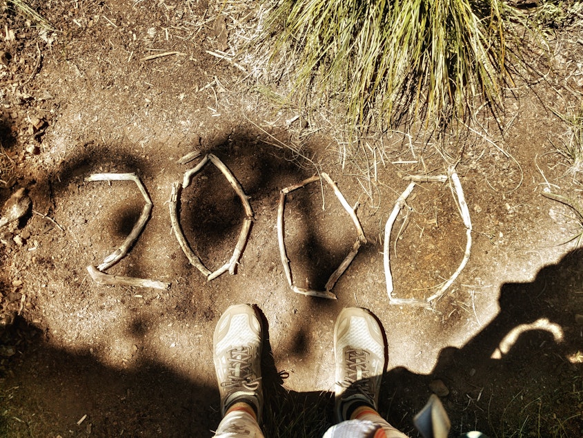 caption: Heather "Anish" Anderson at the 2000 mile mark on the Pacific Crest Trail — south to north.