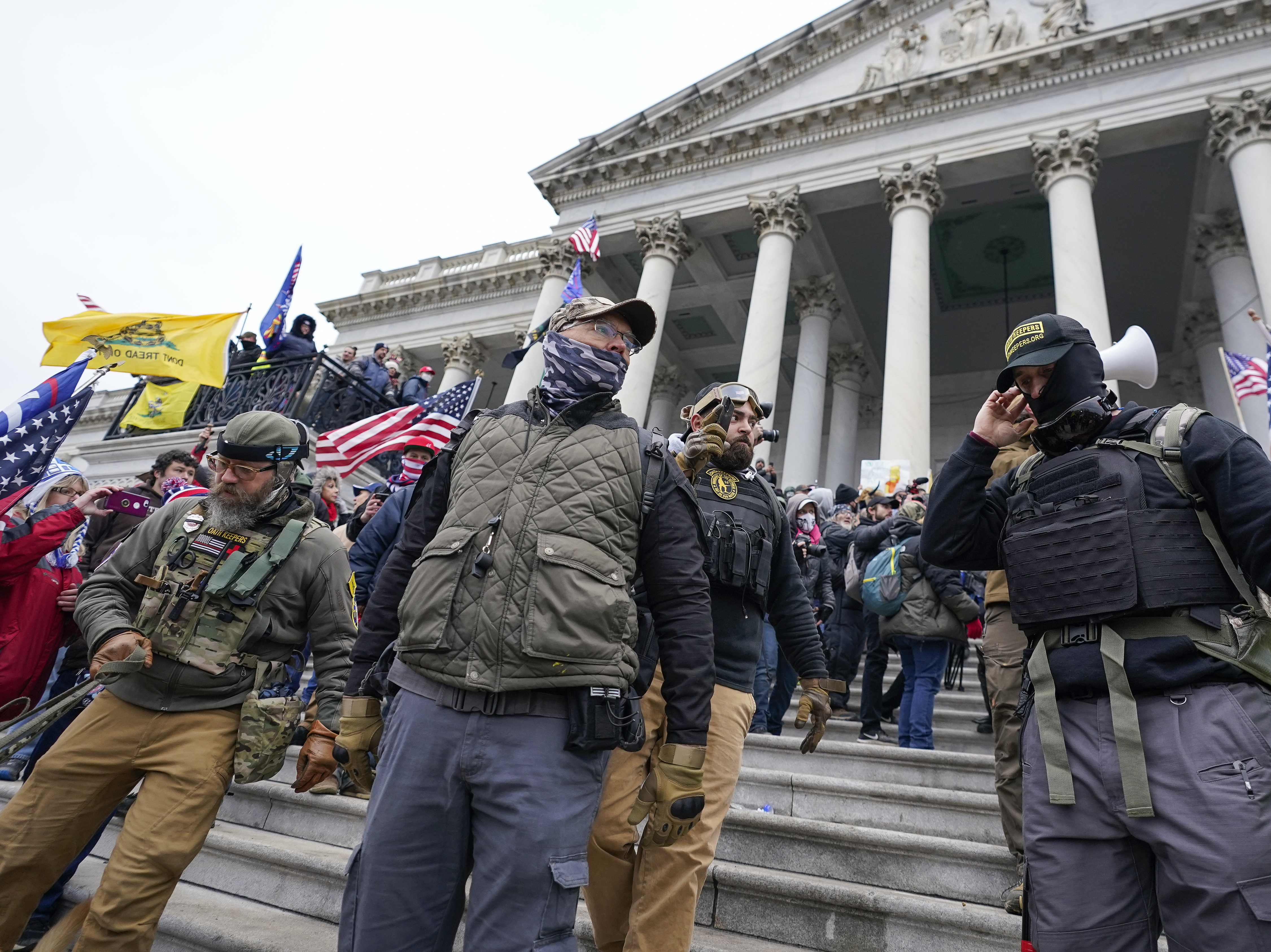 caption: Members of the Oath Keepers on the East Front of the U.S. Capitol on Jan. 6, 2021, in Washington.