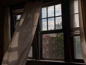 caption: Cracking a window can help reduce your risk of infection by COVID pathogens.
