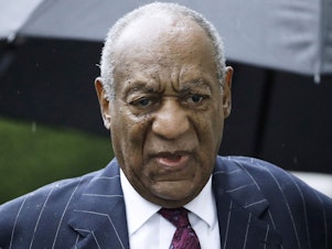 caption: In a new lawsuit, nine women accuse Bill Cosby of using his "power, fame and prestige" to sexually assault them. The 85-year-old is pictured in 2018 arriving for his sexual assault conviction sentencing hearing in Norristown, Pa.
