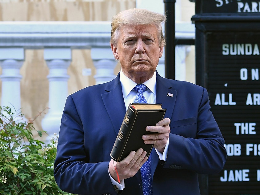 caption: Then-President Donald Trump holds up a Bible outside St. John's Episcopal Church in Washington, D.C., during a controversial 2020 photo-op.