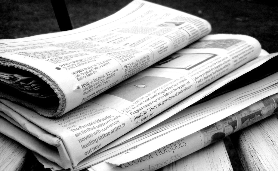 caption: Newspapers in black and white