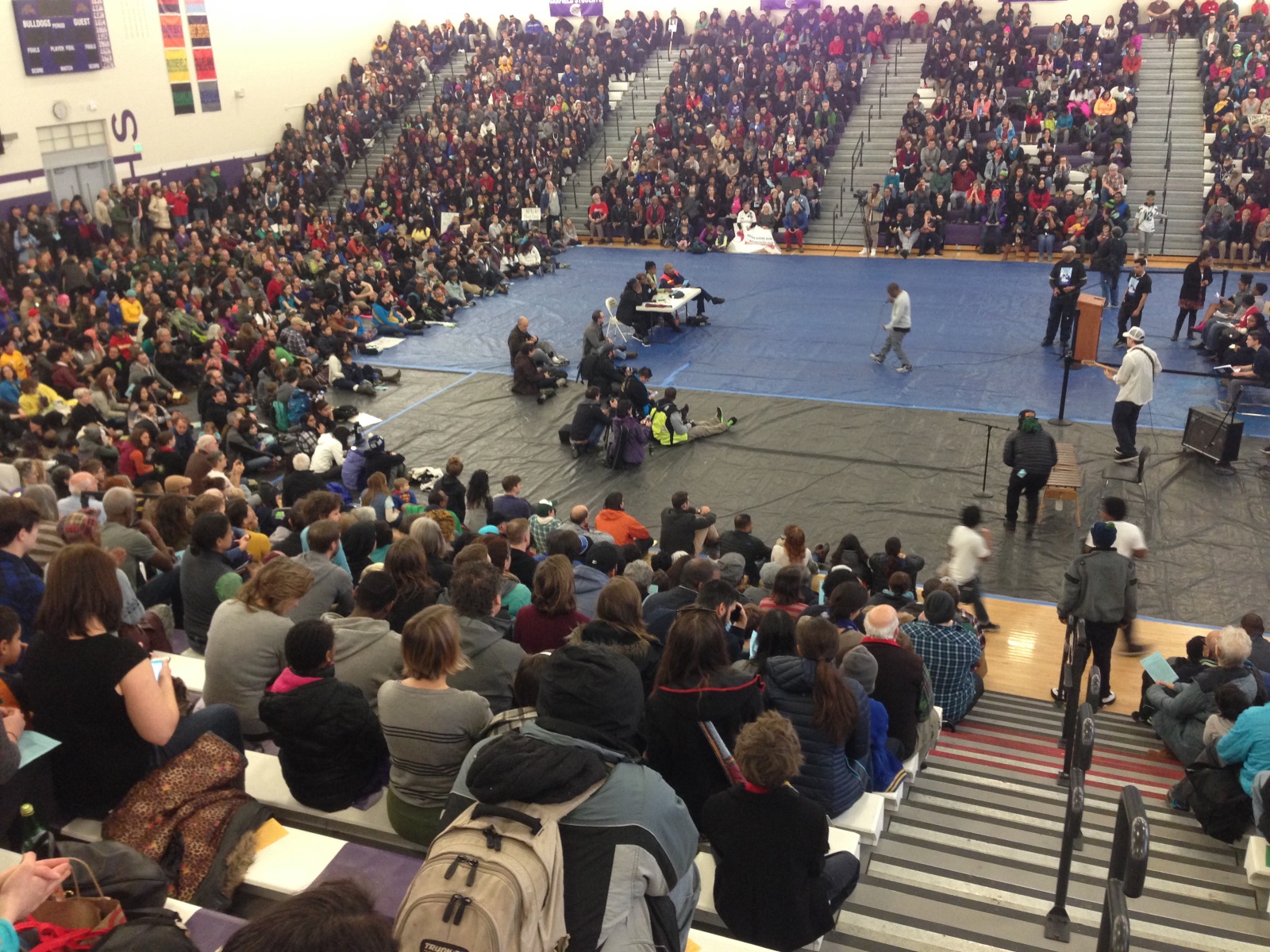 caption: Rapper Draze performs at Garfield High School's Martin Luther King Day rally