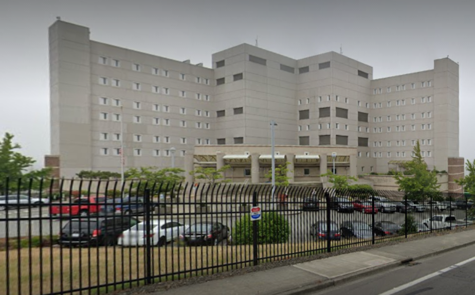 caption: The SeaTac Federal Detention Center, which publicly reports 287 cases of Covid-19 among detainees and staff since the pandemic started, has come under scrutiny for its handling of the disease. 