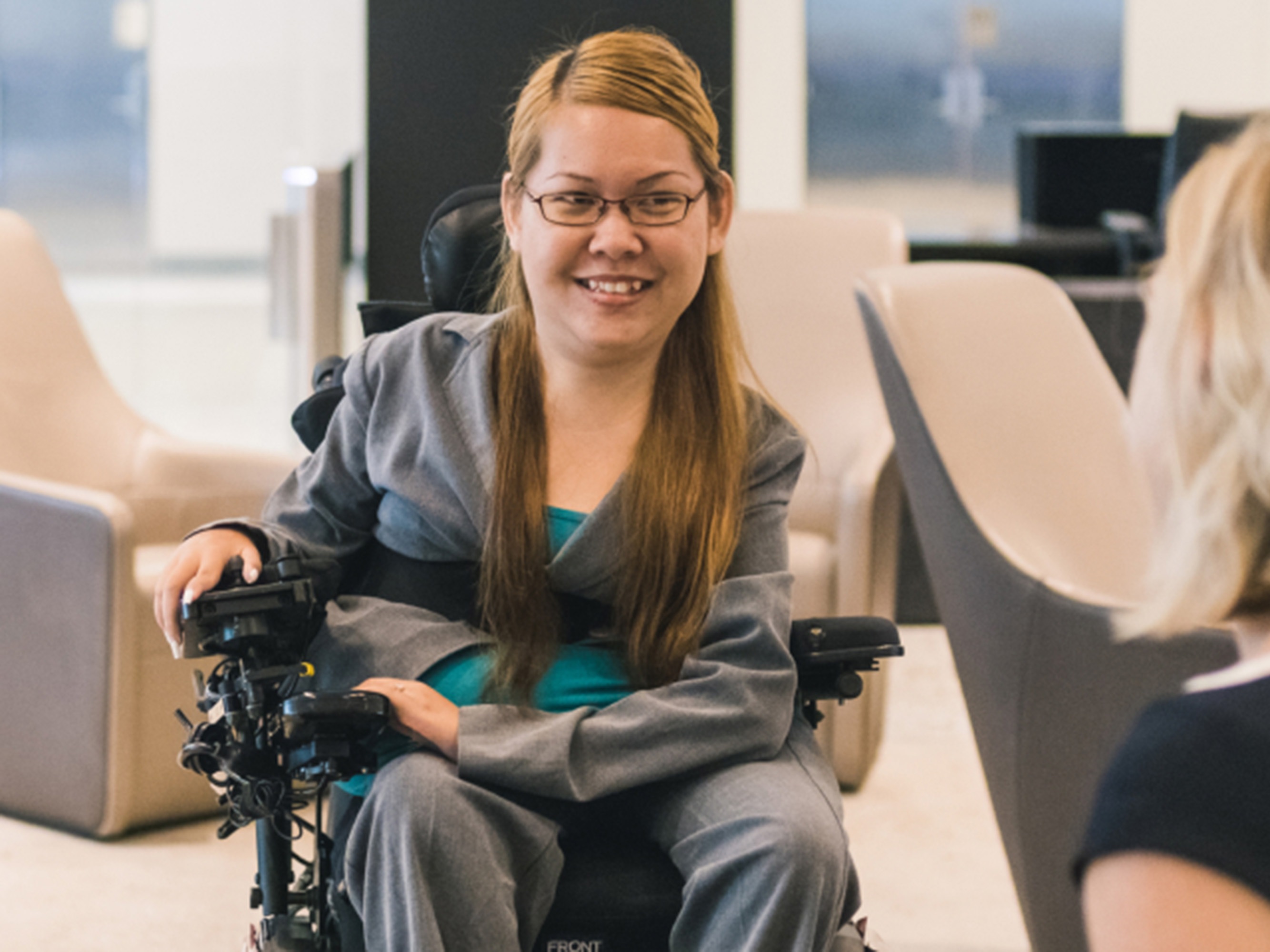 caption: Tabi Haly defied expectations. She's a woman with spinal muscular atrophy — also, a software engineer and a vice president at JPMorgan Chase.