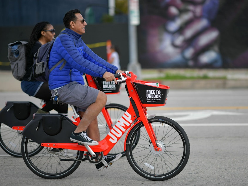 caption: E-bike use is increasing quickly, but many people do not wear helmets. And head injuries from e-bike accidents are rising fast too, a study in JAMA Surgery shows.