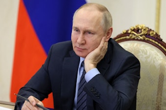 caption: Russian President Vladimir Putin attends an event via video on Wednesday. The Kremlin is downplaying the prospect of Ukraine peace talks after President Biden said he would speak to Putin if "he's looking for a way to end the war."