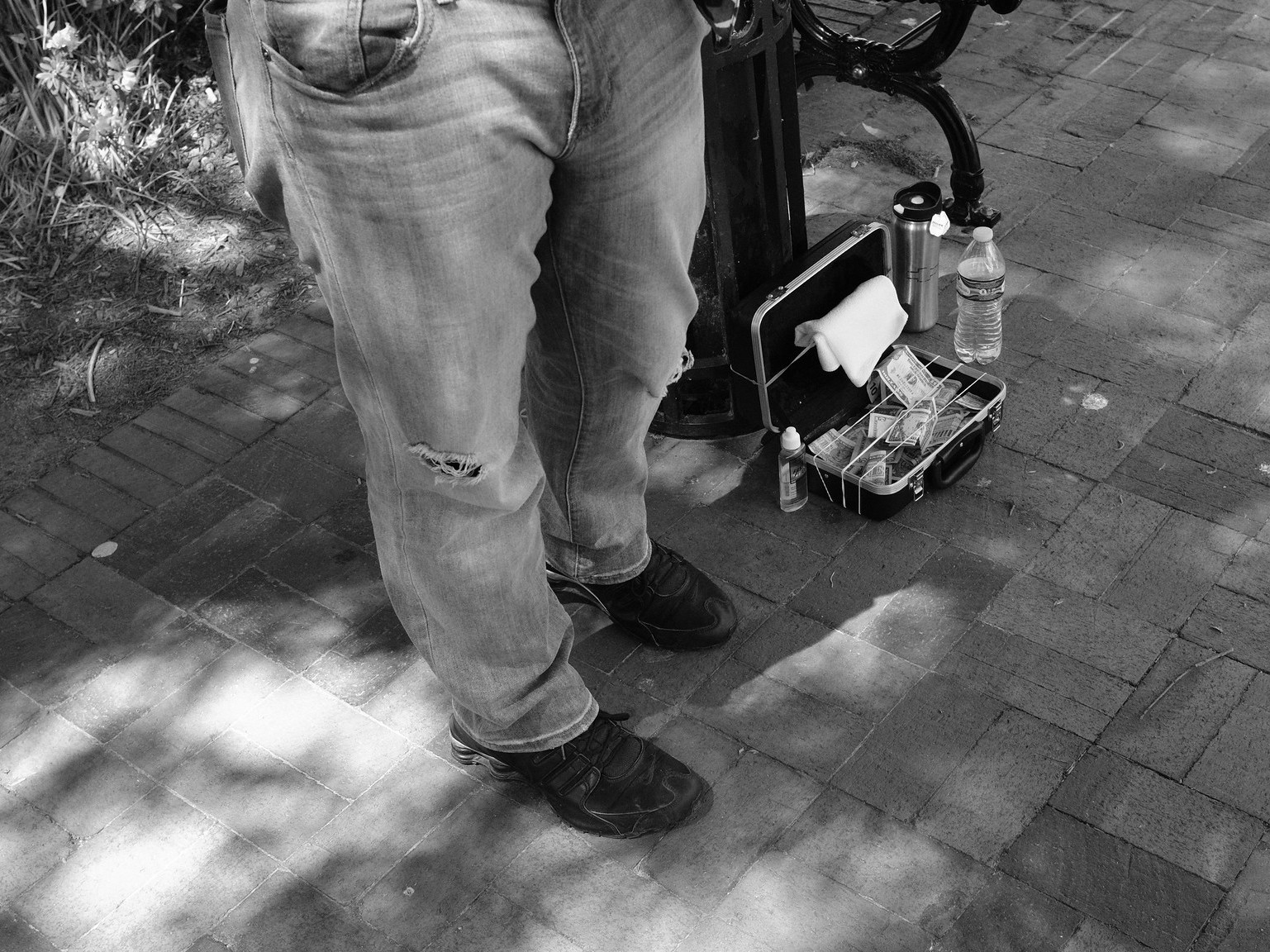 An image of a busker's collected donations in Marietta, Ga., in 2017.