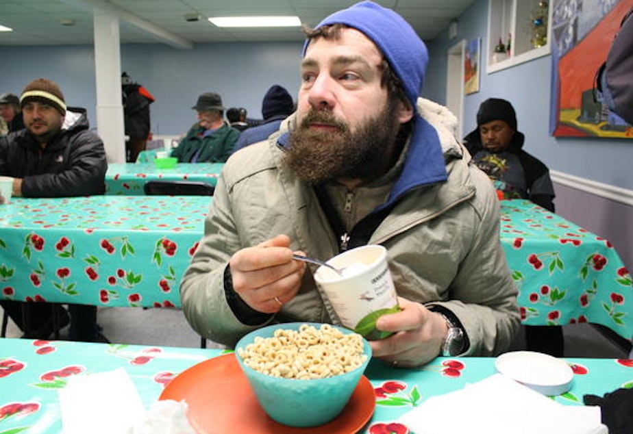 caption: Justin Ingram ate two heaping bowls of cereal, a bowl of oatmeal, two pieces of toast with butter and a rare pint of ice cream for breakfast at St. Luke's Episcopal Church in Ballard on Tuesday morning. Still, he says he's lost 50 pounds while homeless