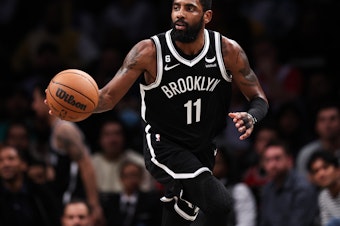 caption: Kyrie Irving is pictured during a game against the Chicago Bulls on Nov. 1 in New York City. Nike has terminated its contract with Irving.