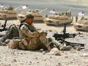 caption: A soldier takes a break during the "Eager Lion" multinational military exercises that the U.S. is part of in Jordan in September 2022.