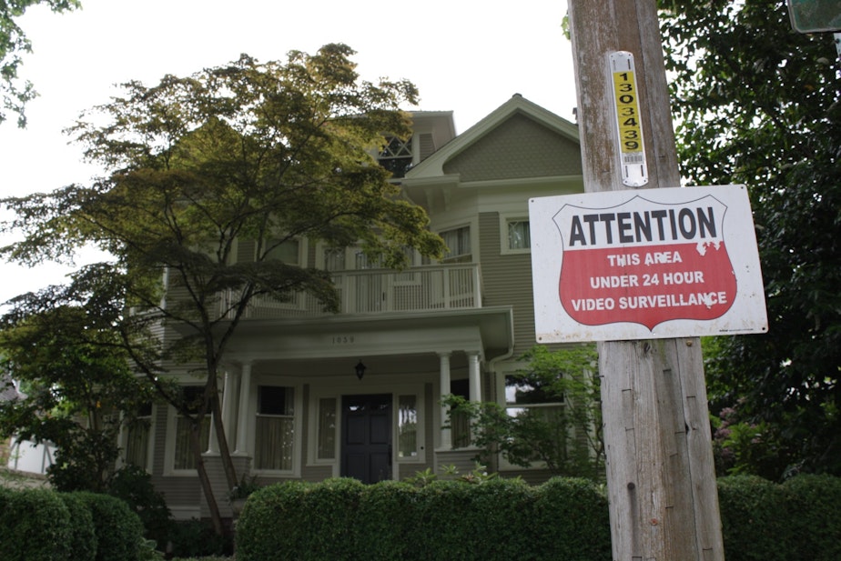 caption: A sign in front of this Seattle house warns of 24 hour video surveillance.