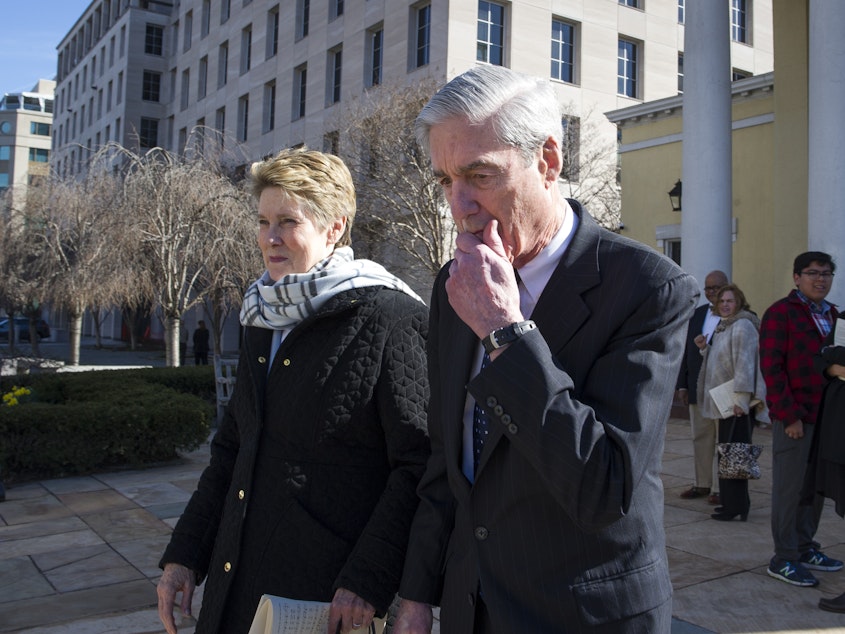 caption: Special counsel Robert Mueller, and his wife Ann, leave St. John's Episcopal Church across from the White House Sunday.