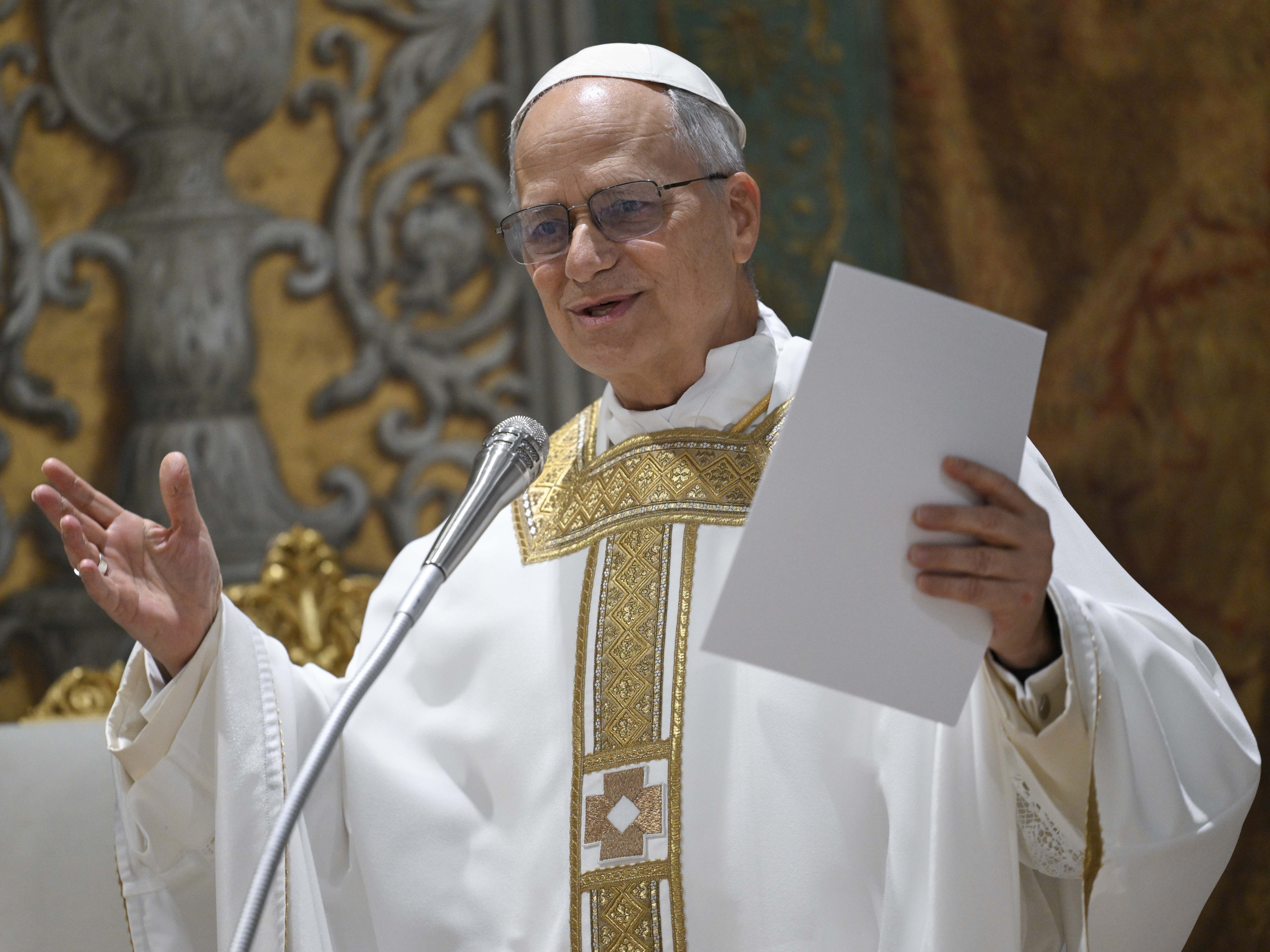 caption: Pope Leo XIV concelebrates Mass with the College of Cardinals inside the Sistine Chapel on Friday, the day after his election.