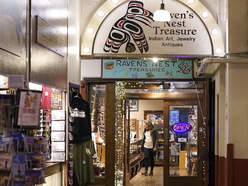 caption: The Raven's Nest Treasure shop in Pike Place Market, is pictured on Friday, in Seattle. Two artists are facing federal charges that they faked Native American heritage to sell works at the shop and another gallery in downtown Seattle.