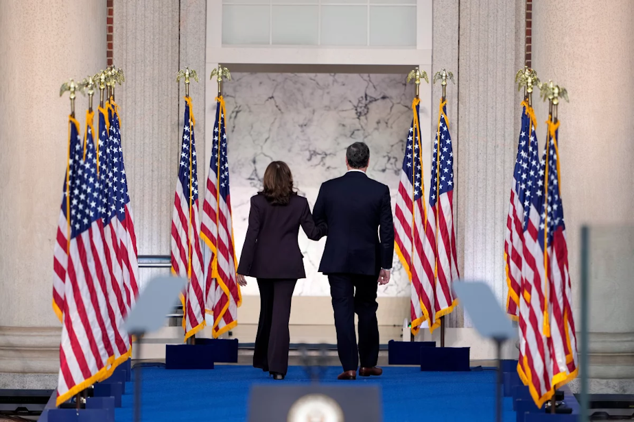caption: Vice President Harris departs the stage with second gentleman Doug Emhoff after conceding the presidential election.