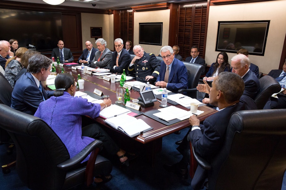 caption: President Barack Obama and Vice President Joe Biden meet with members of the National Security Council in the Situation Room of the White House, Sept. 10, 2014. 