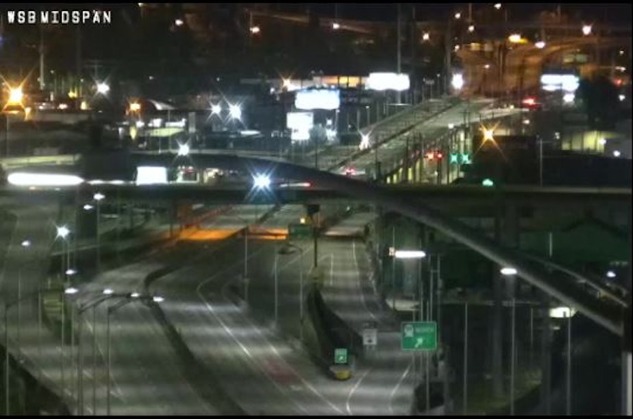 caption: A traffic camera shows the West Seattle Bridge devoid of traffic in March.