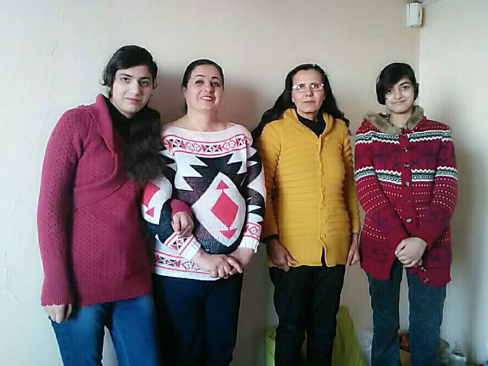 caption: (From left) Brone Yassir, Salwa Rabaa, Abtsam Rabaa and Mary Yassir are refugees from Iraq currently living in Turkey. Their move to Seattle was canceled by President Trump's so-called travel ban. 