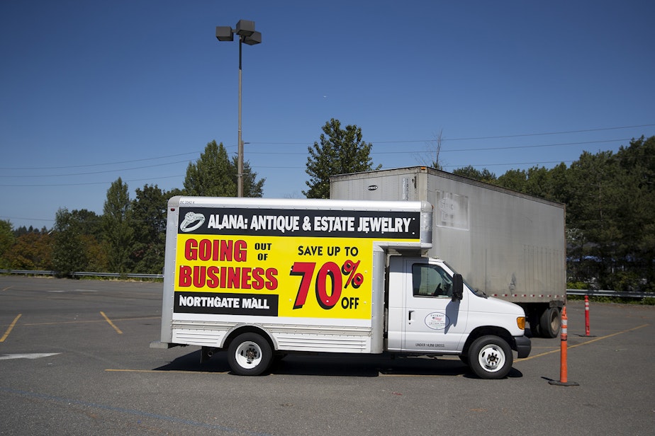 caption: A truck advertising 70% off for items at Alana Jewelry is parked on Monday, July 22, 2019, at Northgate Mall in Seattle. 