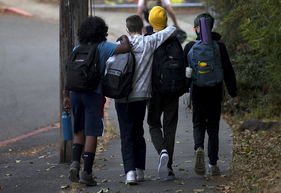 caption: Seattle School for Boys students walk together before the first day of school on Monday, September 13, 2021, along 28th Avenue South in Seattle.