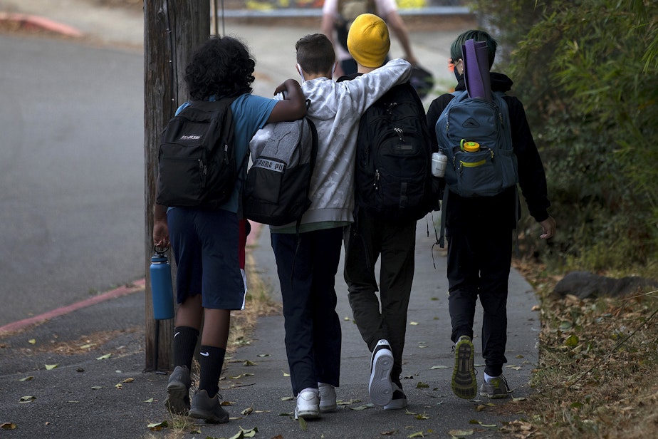 caption: Seattle School for Boys students walk together before the first day of school on Monday, September 13, 2021, along 28th Avenue South in Seattle.