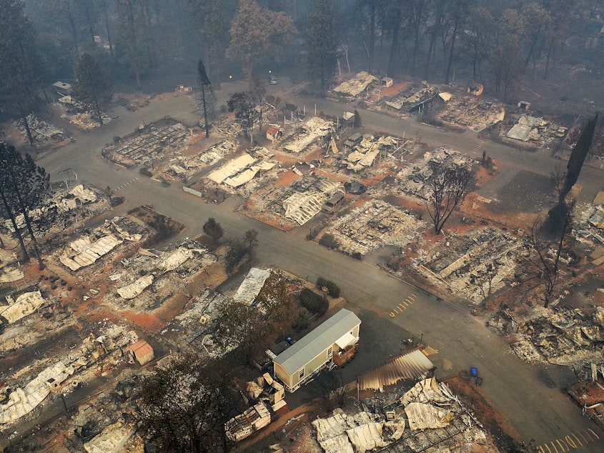 caption: An aerial view of a neighborhood destroyed by the Camp Fire in Paradise, Calif. Fueled by high winds and low humidity, the wildfire ripped through the town, charring more than 140,000 acres and killing more than 60 people.