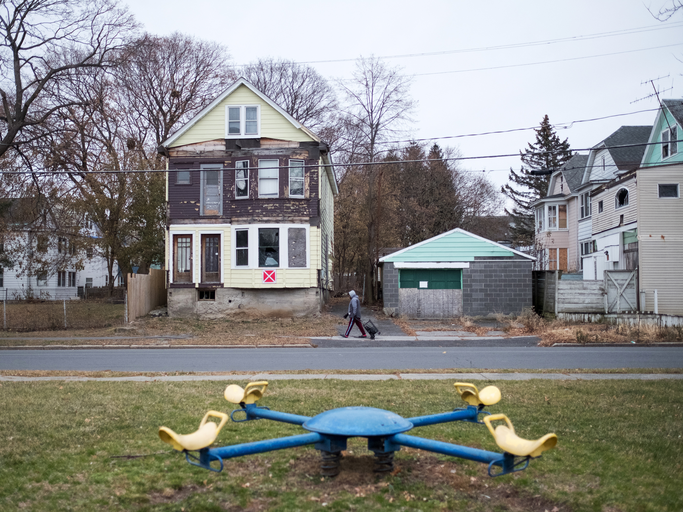caption: Vacant homes marked as unsafe structures in the West Hill neighborhood of Albany, N.Y. New data from the Institute for Child, Youth and Family Policy at Brandeis University reveal a sharp racial divide in access to opportunities in almost every major metropolitan area of the country, including Albany.