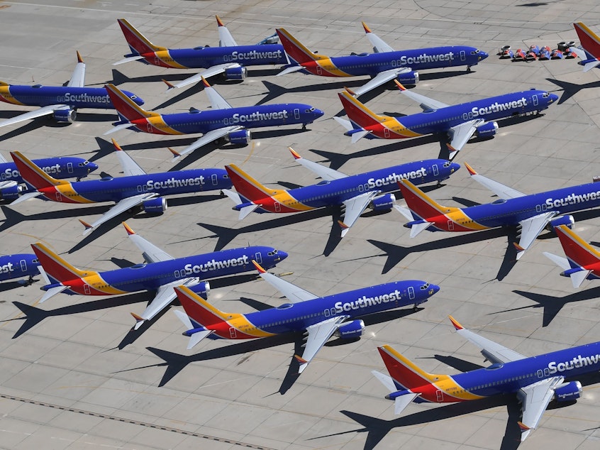 caption: Boeing 737 Max aircraft operated by Southwest Airlines crowd the tarmac of the airport in Victorville, Calif., after the Federal Aviation Administration grounded the planes last year. On Thursday, the FAA released its report on the craft's controversial certification process.