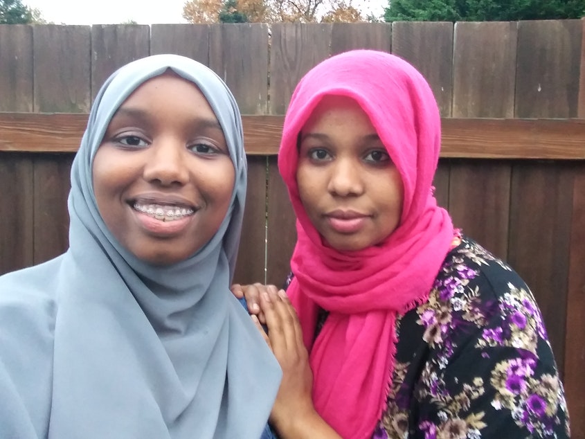 caption: RadioActive youth producer Marian Mohamed (left) with her mother, Mulki. Mulki was in the same refugee camp as Representative Ilhan Omar.