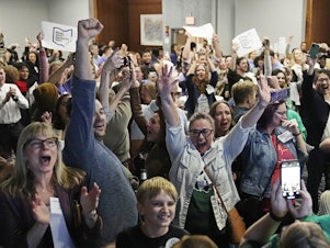 caption: Supporters for a pro-abortion ballot measure cheer as they watch election results come in on Tuesday in Columbus, Ohio.