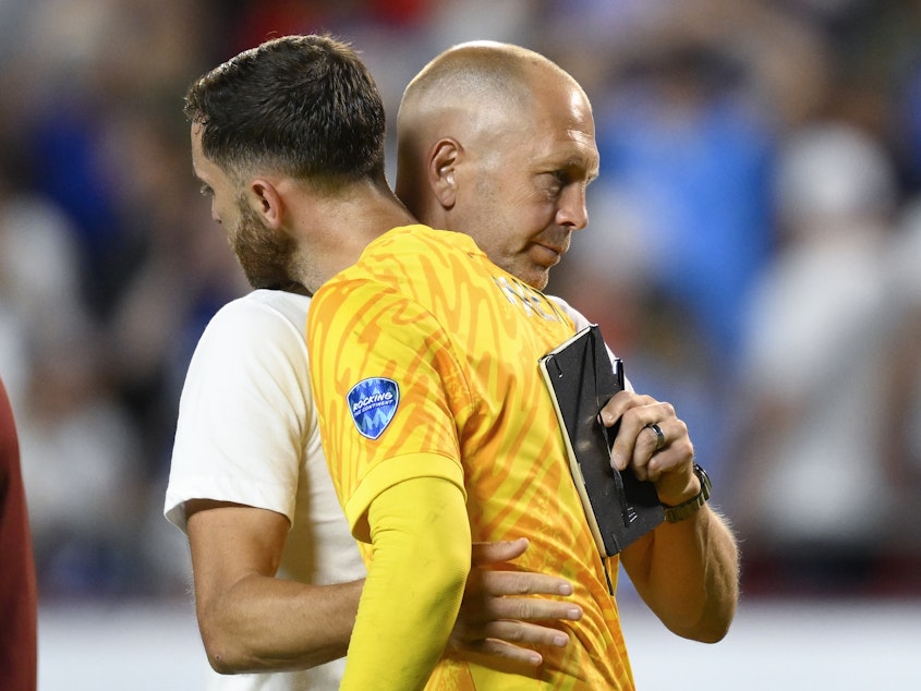 caption: Coach Gregg Berhalter of the United States greets goalkeeper Matt Turner after losing 0-1 against Uruguay at the end of a Copa America Group C soccer match in Kansas City, Mo., on Monday.