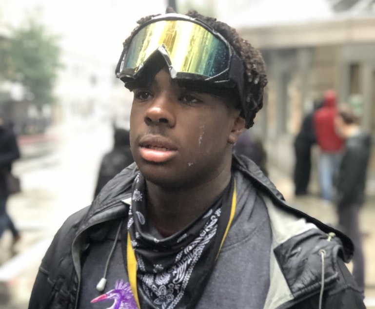 caption: The younger Omari Salisbury at a Seattle protest