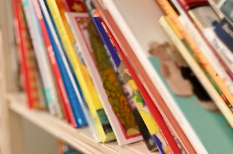 caption: Scholastic says it will stop offering the controversial collection of race- and gender-related titles at middle school book fairs starting in January.