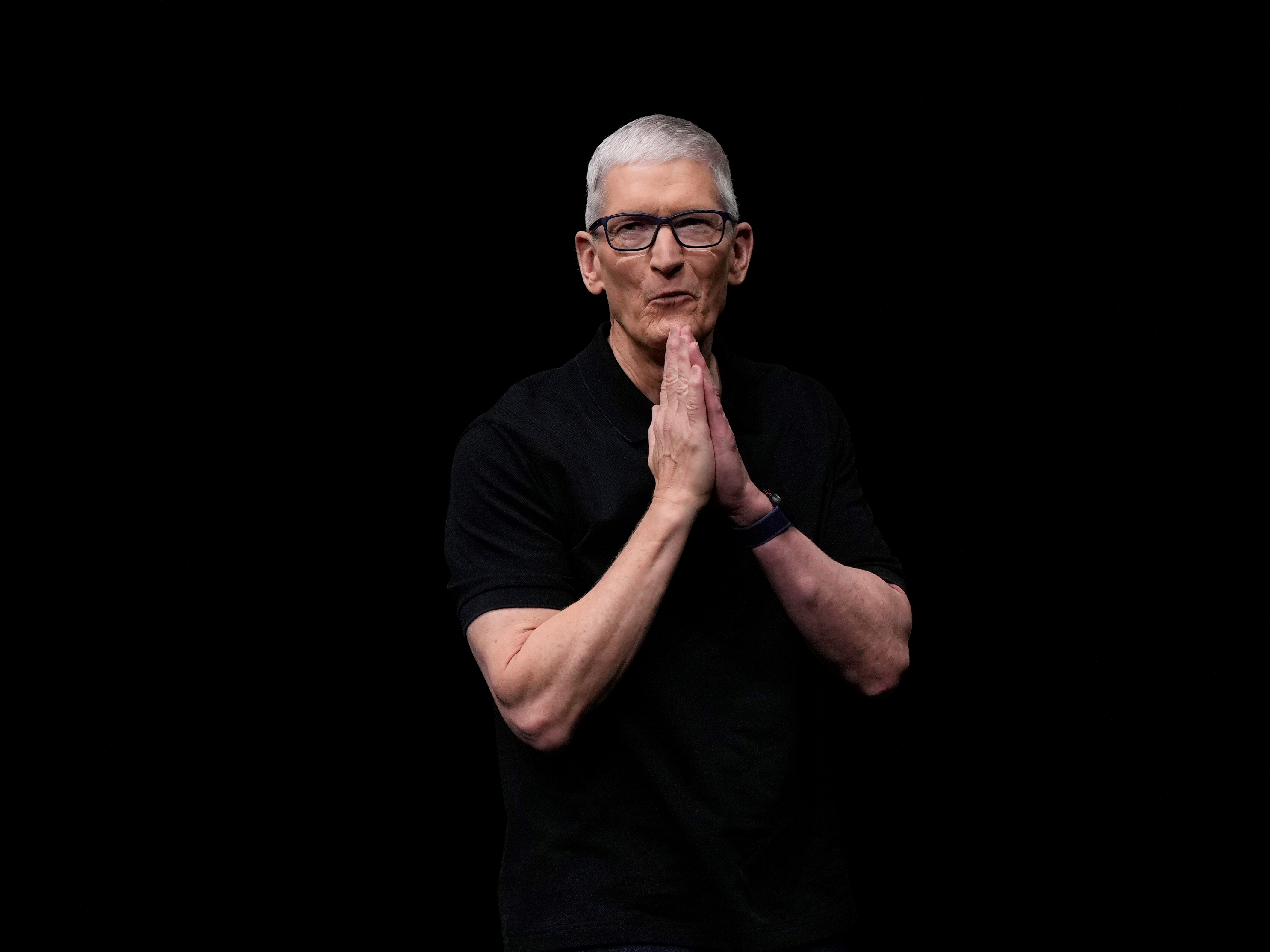 caption: Apple CEO Tim Cook speaks on stage during an announcement of new products at Apple Park in Cupertino, Calif., on Sept. 9.
